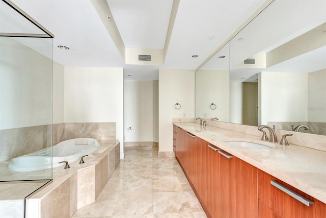 241 Riverside Dr Unit 1107, Daytona Beach, FL 32117 - full bath with visible vents, a garden tub, double vanity, and a sink