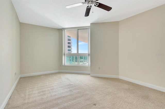 241 Riverside Dr Unit 1107, Daytona Beach, FL 32117 - unfurnished room featuring ceiling fan, light colored carpet, and baseboards