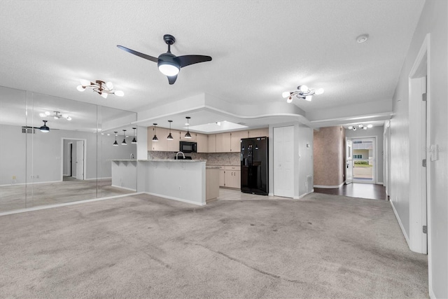 2231 Utopian Dr E Unit 117, Clearwater, FL 33763 - unfurnished living room featuring a textured ceiling, light colored carpet, a ceiling fan, and baseboards