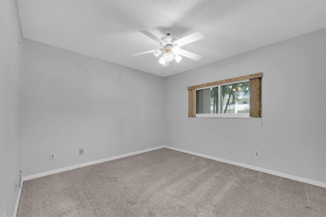 2231 Utopian Dr E Unit 117, Clearwater, FL 33763 - carpeted empty room featuring a ceiling fan, a textured ceiling, and baseboards