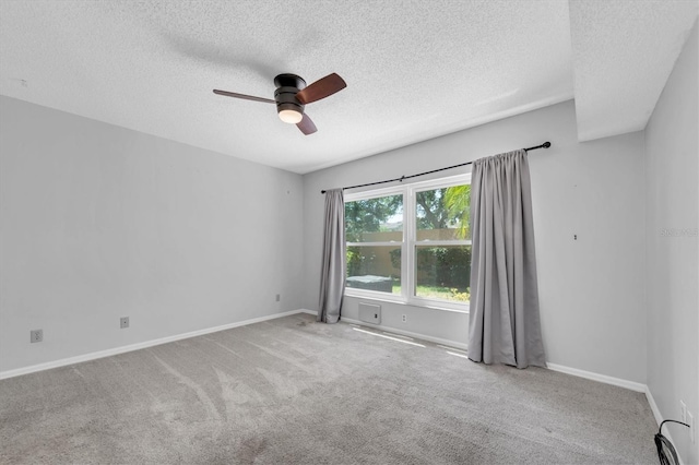 2231 Utopian Dr E Unit 117, Clearwater, FL 33763 - unfurnished room with a textured ceiling, ceiling fan, carpet flooring, and baseboards