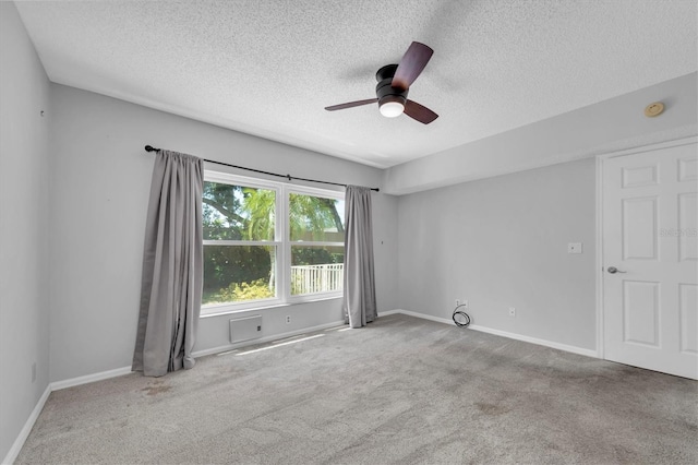 2231 Utopian Dr E Unit 117, Clearwater, FL 33763 - empty room featuring a textured ceiling, a ceiling fan, carpet, and baseboards