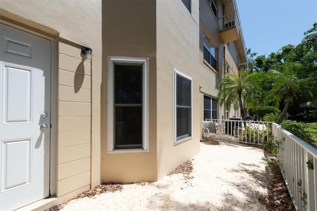 2231 Utopian Dr E Unit 117, Clearwater, FL 33763 - property entrance with stucco siding