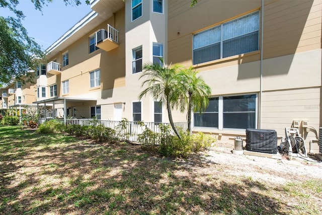 2231 Utopian Dr E Unit 117, Clearwater, FL 33763 - rear view of house featuring stucco siding