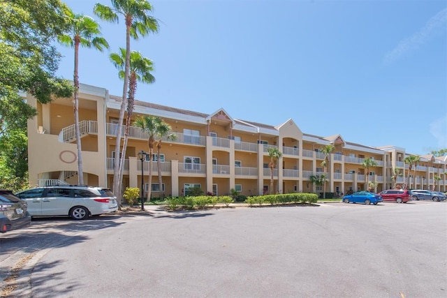 2231 Utopian Dr E Unit 117, Clearwater, FL 33763 - view of apartment building / complex with uncovered parking