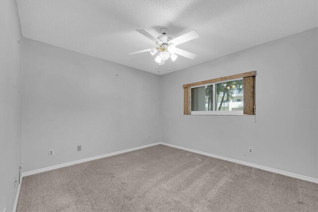 2231 Utopian Dr E Unit 117, Clearwater, FL 33763 - carpeted empty room featuring a ceiling fan, a textured ceiling, and baseboards