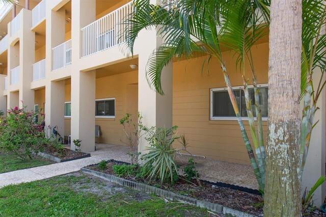 2231 Utopian Dr E Unit 117, Clearwater, FL 33763 - view of property exterior with stucco siding