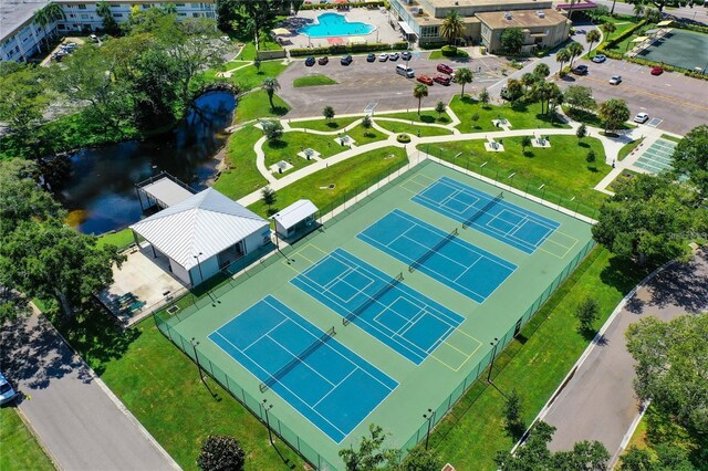2231 Utopian Dr E Unit 117, Clearwater, FL 33763 - drone / aerial view of a pool and a large body of water