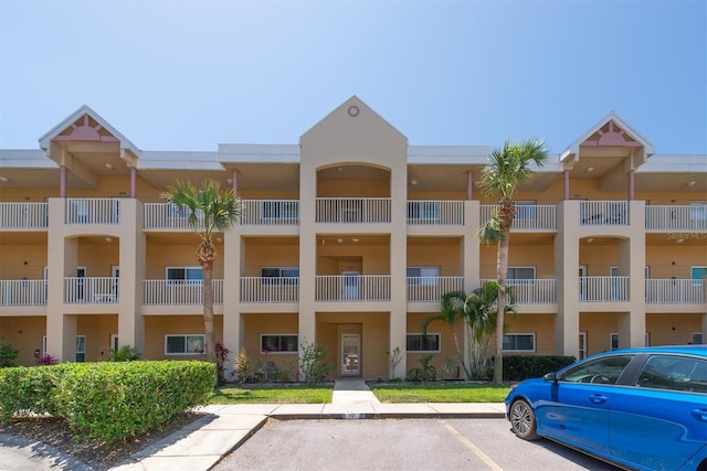 2231 Utopian Dr E Unit 117, Clearwater, FL 33763 - view of apartment building / complex with uncovered parking