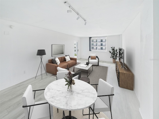 201 W Laurel St Unit 504B, Tampa, FL 33602 - living room with light wood finished floors and rail lighting