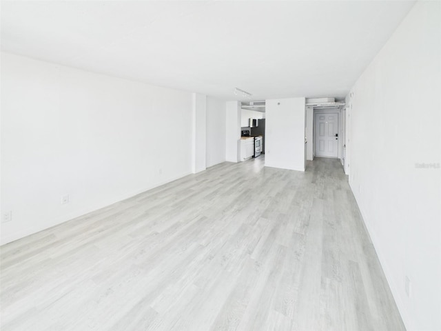 201 W Laurel St Unit 504B, Tampa, FL 33602 - unfurnished living room with light wood finished floors