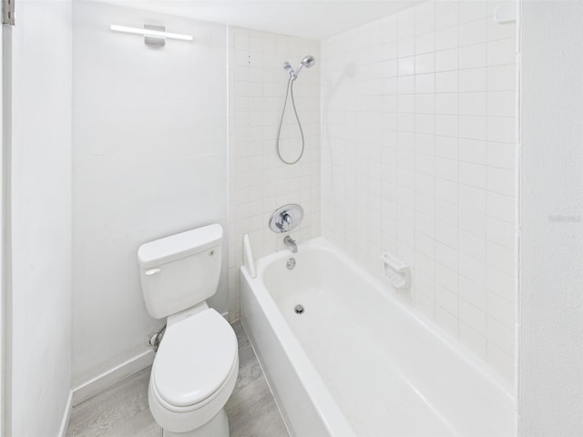 201 W Laurel St Unit 504B, Tampa, FL 33602 - full bathroom with toilet, tub / shower combination, baseboards, and wood finished floors