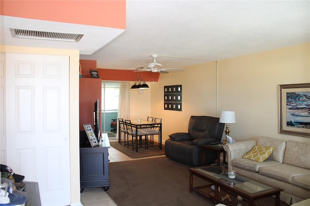 9950 47th Ave N Unit 311, Saint Petersburg, FL 33708 - living area featuring visible vents, light tile patterned floors, and ceiling fan