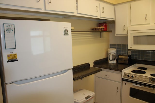 9950 47th Ave N Unit 311, Saint Petersburg, FL 33708 - kitchen with white cabinetry, open shelves, white appliances, and decorative backsplash