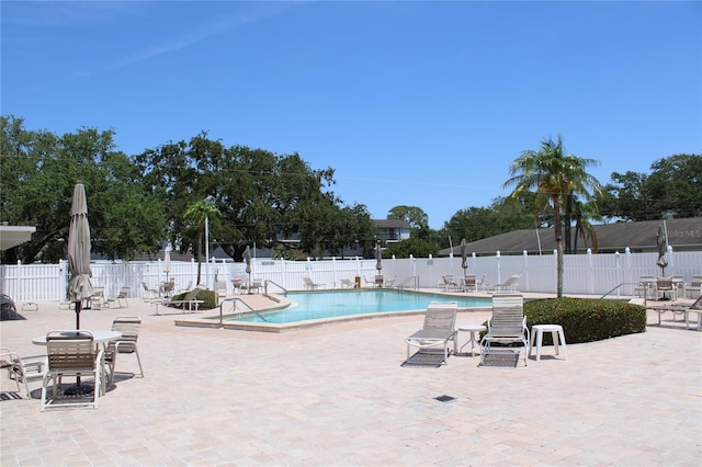 9950 47th Ave N Unit 311, Saint Petersburg, FL 33708 - pool with fence and a patio area
