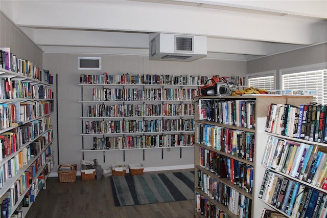 9950 47th Ave N Unit 311, Saint Petersburg, FL 33708 - interior space with bookshelves, wood finished floors, and visible vents