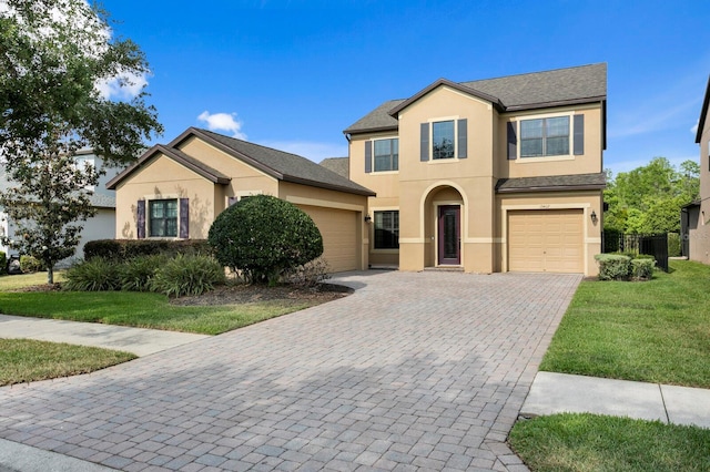 19407 Sweet Grass Way, Lutz, FL 33558 - view of front of house featuring a front lawn, stucco siding, and decorative driveway