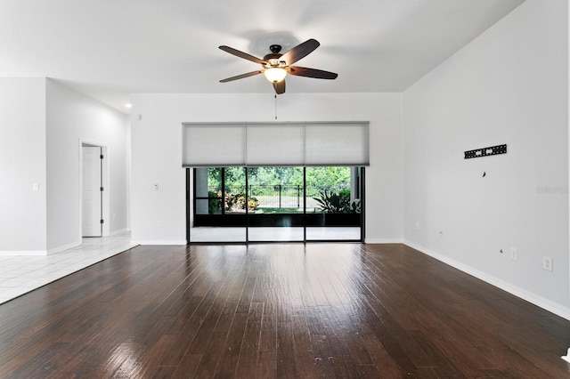19407 Sweet Grass Way, Lutz, FL 33558 - unfurnished living room with hardwood / wood-style floors, baseboards, and ceiling fan