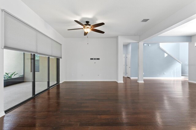 19407 Sweet Grass Way, Lutz, FL 33558 - unfurnished living room featuring stairs, wood-type flooring, baseboards, visible vents, and a ceiling fan