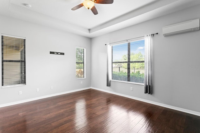 19407 Sweet Grass Way, Lutz, FL 33558 - unfurnished room with an AC wall unit, a ceiling fan, wood finished floors, and baseboards