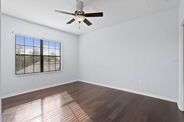 19407 Sweet Grass Way, Lutz, FL 33558 - unfurnished room with baseboards, visible vents, ceiling fan, and dark wood-style flooring