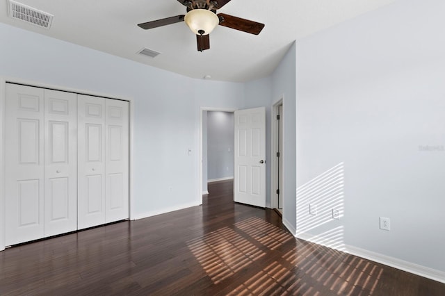19407 Sweet Grass Way, Lutz, FL 33558 - unfurnished bedroom with baseboards, visible vents, wood finished floors, and a closet