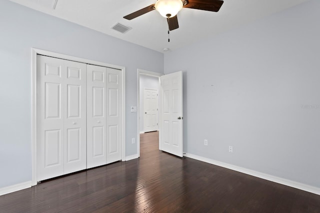19407 Sweet Grass Way, Lutz, FL 33558 - unfurnished bedroom with a closet, a ceiling fan, visible vents, baseboards, and wood finished floors