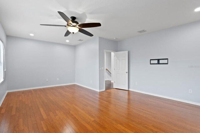 19407 Sweet Grass Way, Lutz, FL 33558 - unfurnished room featuring recessed lighting, wood finished floors, baseboards, visible vents, and a ceiling fan