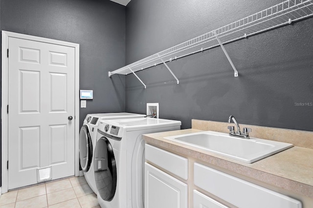 19407 Sweet Grass Way, Lutz, FL 33558 - washroom featuring light tile patterned flooring, washer and dryer, and a sink