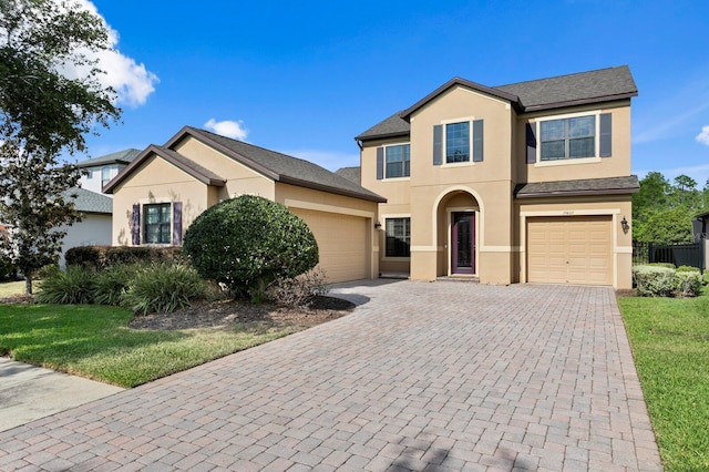 19407 Sweet Grass Way, Lutz, FL 33558 - view of front of home featuring stucco siding, decorative driveway, a front yard, and an attached garage