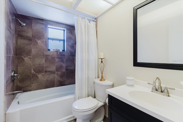 full bath featuring vanity, shower / bath combo with shower curtain, and toilet