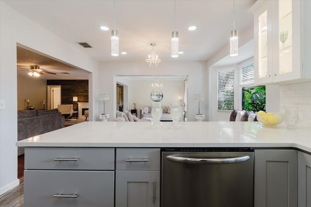 kitchen with visible vents, dishwasher, light countertops, open floor plan, and gray cabinetry