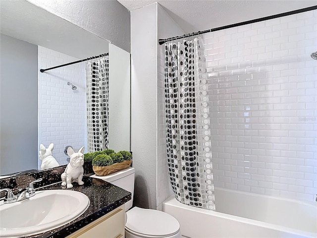 bathroom featuring shower / bath combo, toilet, a textured wall, and vanity