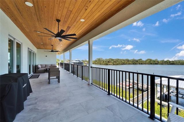 935 Chipaway Dr, Apollo Beach, FL 33572 - balcony with a water view, an outdoor living space, and a ceiling fan