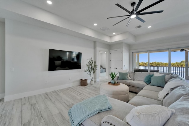 935 Chipaway Dr, Apollo Beach, FL 33572 - living room with a ceiling fan, baseboards, a raised ceiling, wood finished floors, and recessed lighting