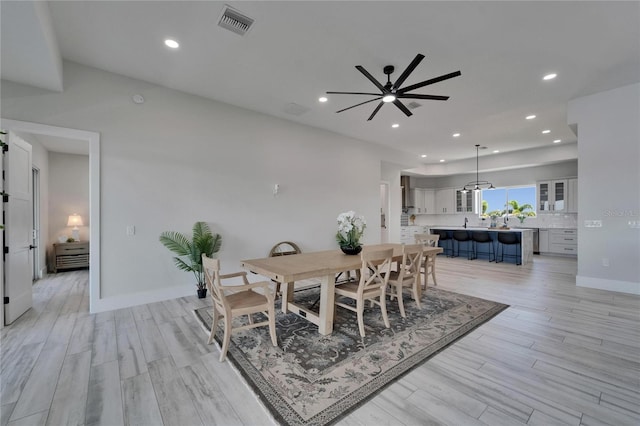 935 Chipaway Dr, Apollo Beach, FL 33572 - dining area with light wood-style flooring, ceiling fan, recessed lighting, and baseboards