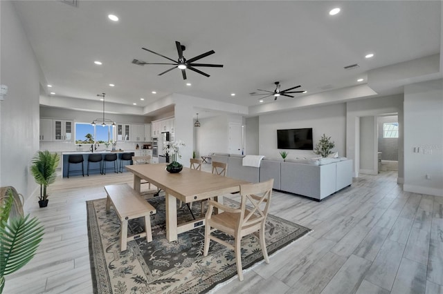 935 Chipaway Dr, Apollo Beach, FL 33572 - dining room featuring a ceiling fan, recessed lighting, light wood-type flooring, plenty of natural light, and baseboards