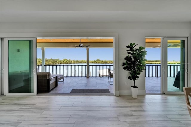 935 Chipaway Dr, Apollo Beach, FL 33572 - entryway featuring a ceiling fan, a water view, and wood tiled floors