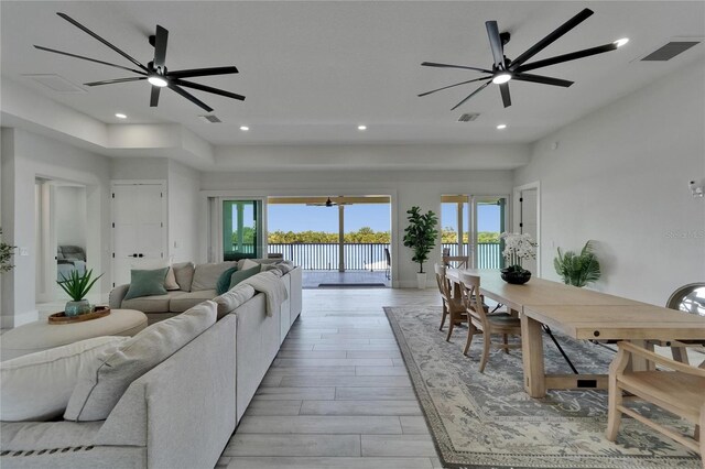 935 Chipaway Dr, Apollo Beach, FL 33572 - living area featuring ceiling fan, light wood-style flooring, a water view, and recessed lighting