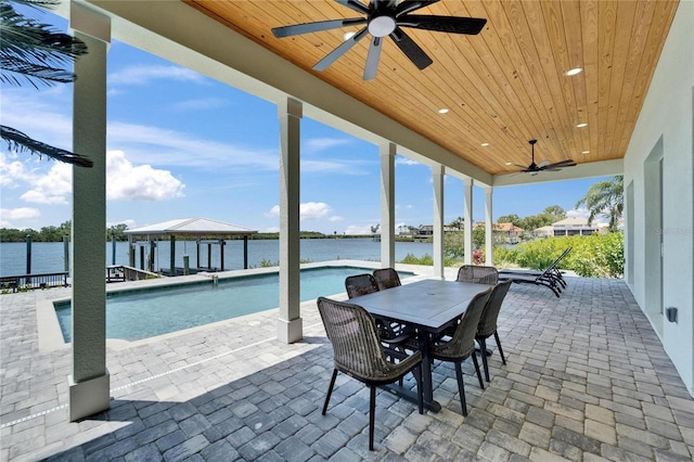 935 Chipaway Dr, Apollo Beach, FL 33572 - view of patio featuring a ceiling fan, an outdoor pool, outdoor dining space, a water view, and a gazebo