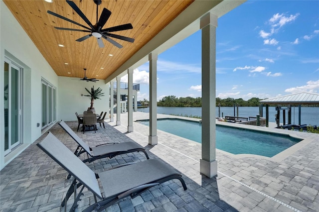 935 Chipaway Dr, Apollo Beach, FL 33572 - outdoor pool featuring a ceiling fan, a water view, and a patio area