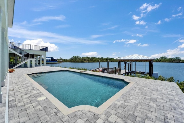 935 Chipaway Dr, Apollo Beach, FL 33572 - outdoor pool featuring stairs, a water view, a patio area, and a dock