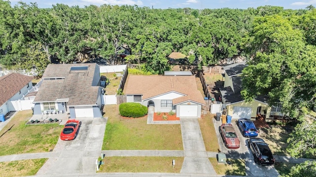 bird's eye view with a wooded view