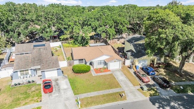 drone / aerial view with a wooded view