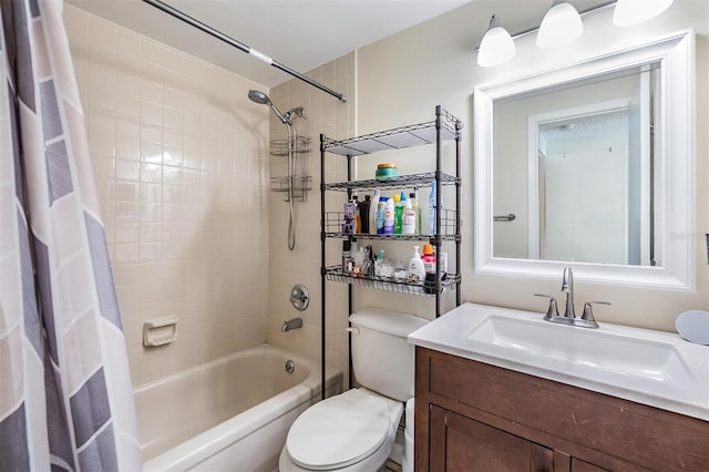 bathroom with vanity, toilet, and shower / bath combo with shower curtain