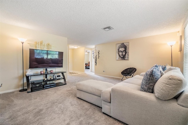 carpeted living room with baseboards, a textured ceiling, and visible vents