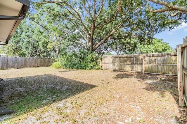 view of yard with a fenced backyard
