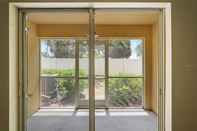 doorway featuring a healthy amount of sunlight and concrete floors