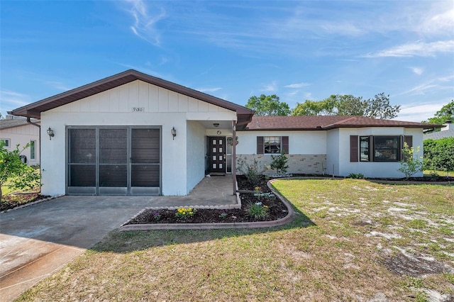 single story home with a front lawn and stucco siding