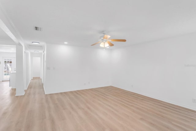 empty room with visible vents, recessed lighting, baseboards, light wood-type flooring, and a ceiling fan